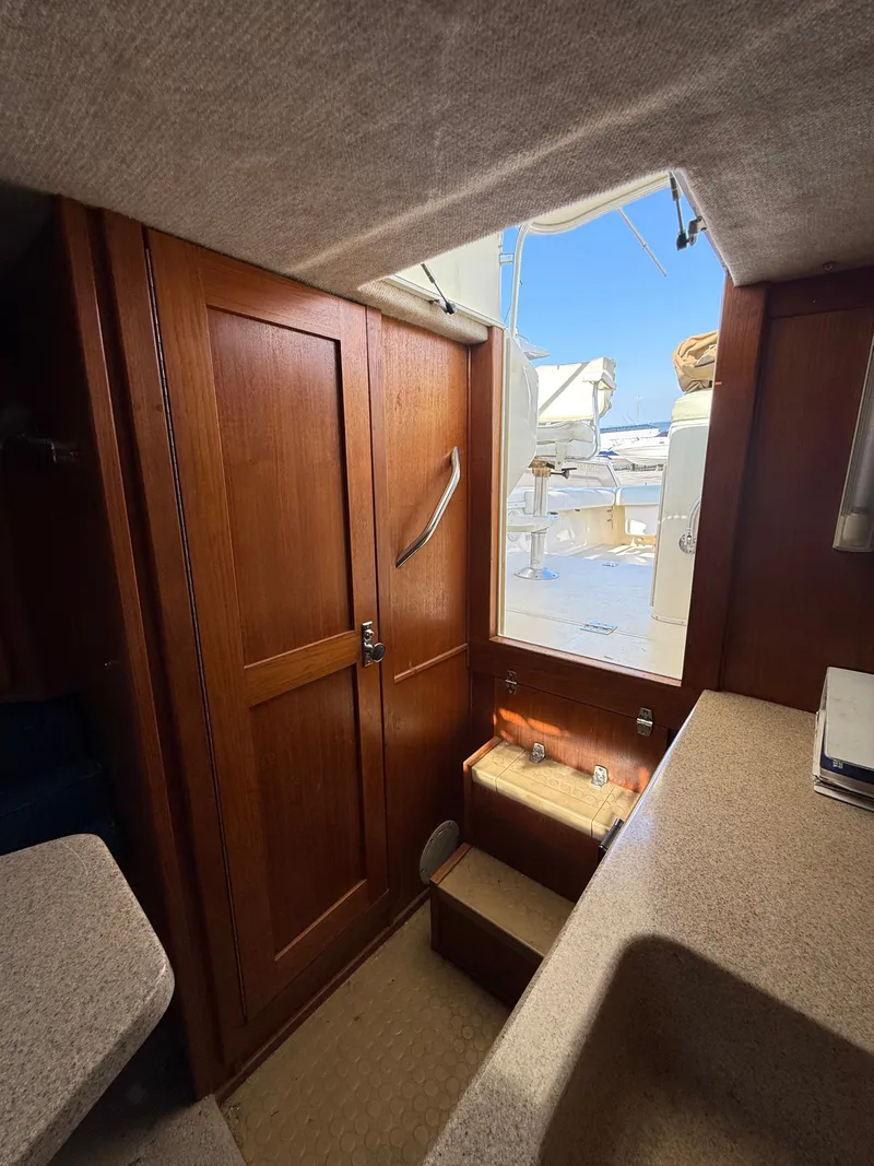 Slide: The Image of Interior of 2004 Albemarle 268 Express Fisherman with wooden doors and steps. - 39