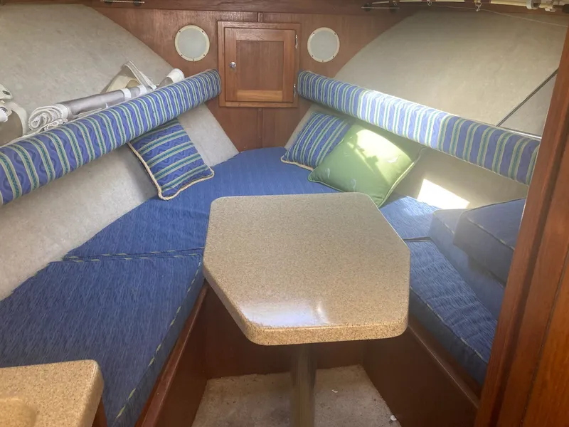 Slide: The Image of Interior of 2004 Albemarle 268 Express Fisherman with blue cushions. - 4