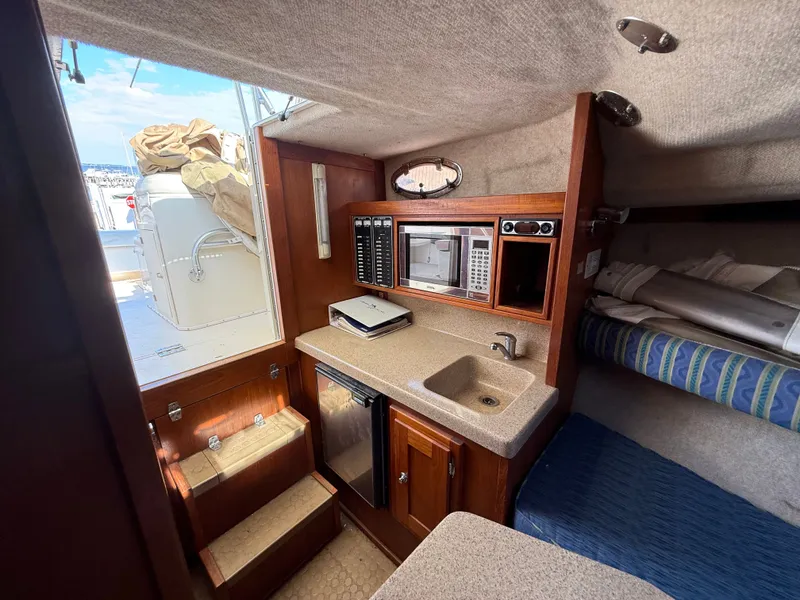 Slide: The Image of Interior of 2004 Albemarle 268 Express Fisherman with kitchenette and sleeping area. - 41