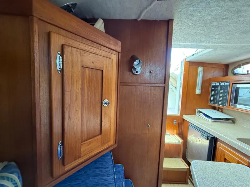 Slide: The Image of Interior of 2004 Albemarle 268 Express Fisherman with wooden cabinetry. - 42
