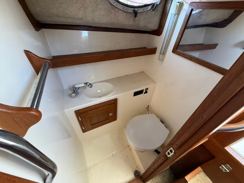 Slide: The Image of Interior of 2004 Albemarle 268 Express Fisherman with sink and toilet. - 43