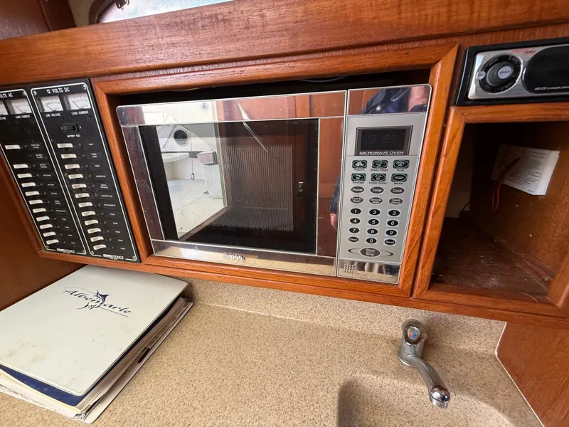 Slide: The Image of 2004 Albemarle 268 Express Fisherman kitchen area with microwave. - 45