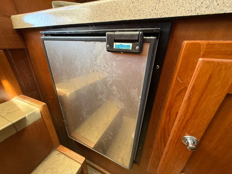 Slide: The Image of Refrigerator in Albemarle 268 Express Fisherman 2004 boat cabin. - 46