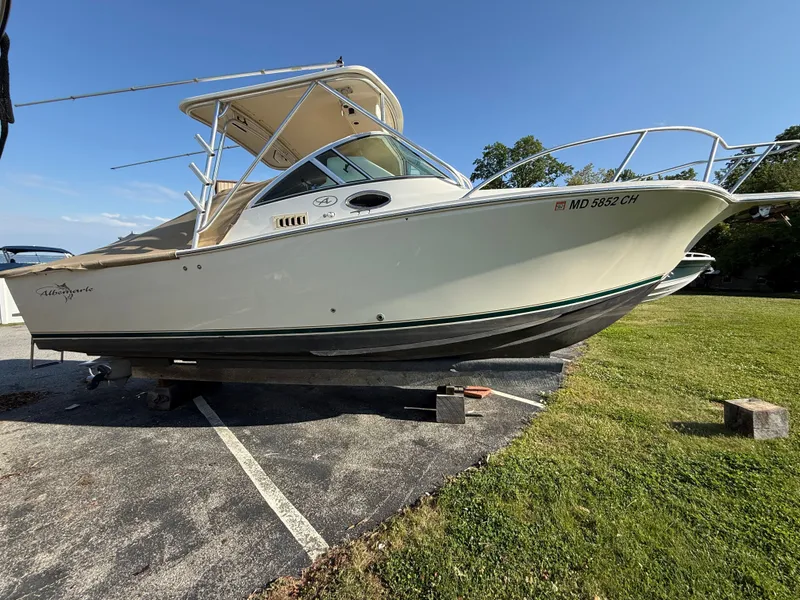 Slide: The Image of 2004 Albemarle 268 Express Fisherman boat on a parking lot. - 47