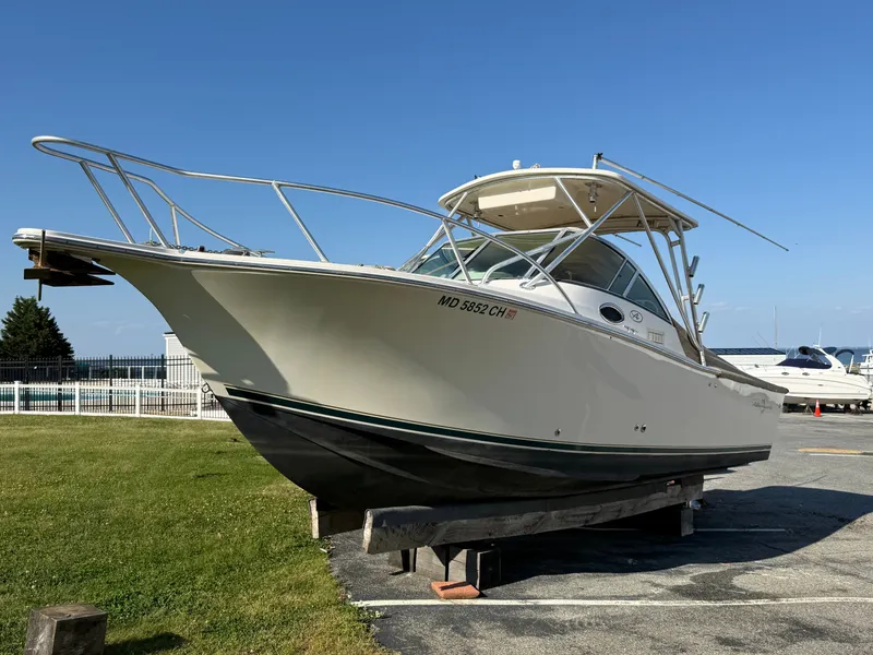 Slide: The Image of 2004 Albemarle 268 Express Fisherman on a boat lift. - 48