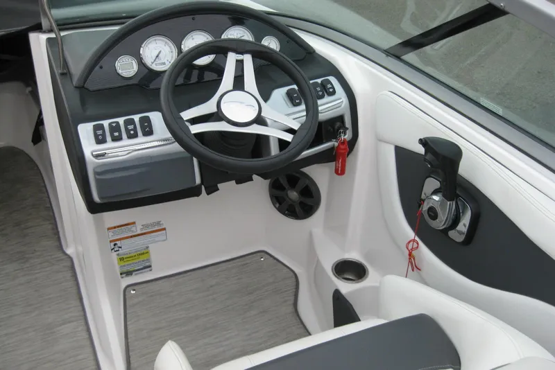 Slide: The Image of 2017 Regal 2000 ES Bowrider dashboard with steering wheel and controls. - 12