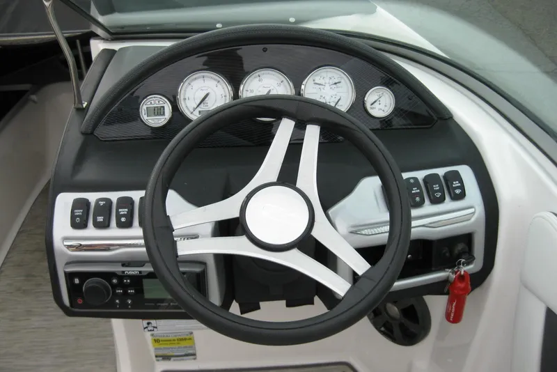Slide: The Image of Steering console of 2017 Regal 2000 ES Bowrider with gauges and controls. - 13