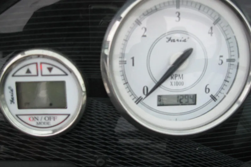 Slide: The Image of Dashboard gauges of a 2017 Regal 2000 ES Bowrider boat. - 14
