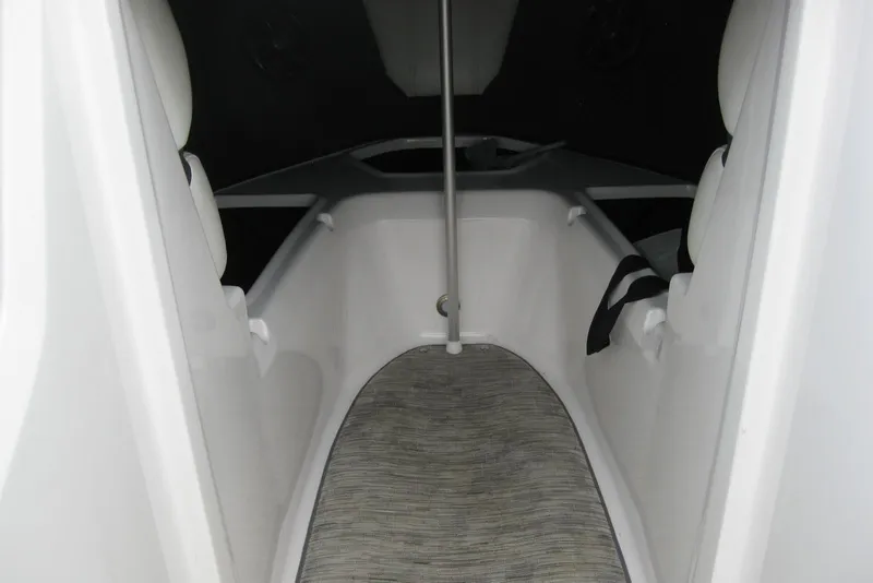 Slide: The Image of 2017 Regal 2000 ES Bowrider interior with seating and carpeted flooring. - 24