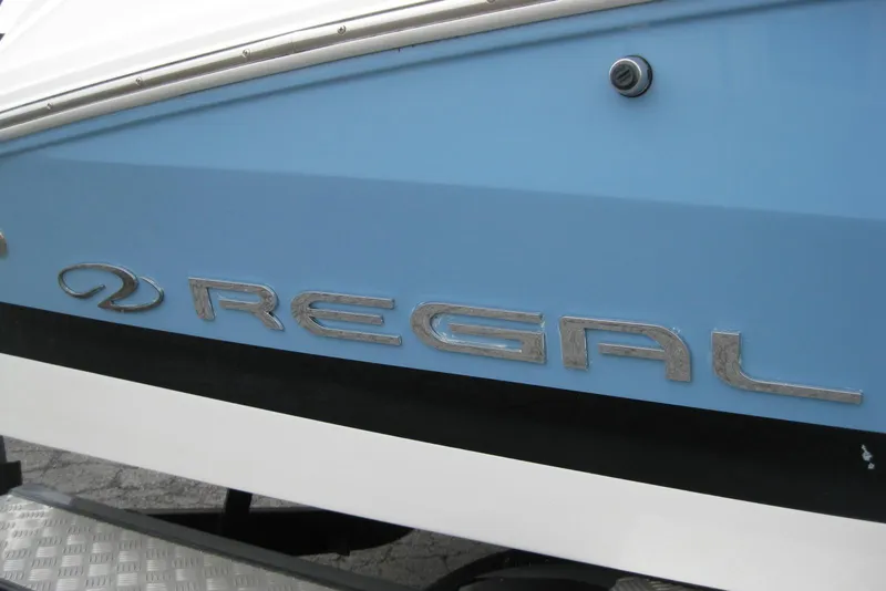 Slide: The Image of 2017 Regal 2000 ES Bowrider boat with blue and white exterior. - 3
