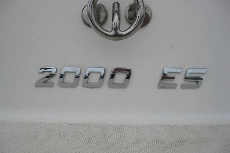 Slide: The Image of Chrome "2000 ES" emblem on a 2017 Regal Bowrider boat. - 4
