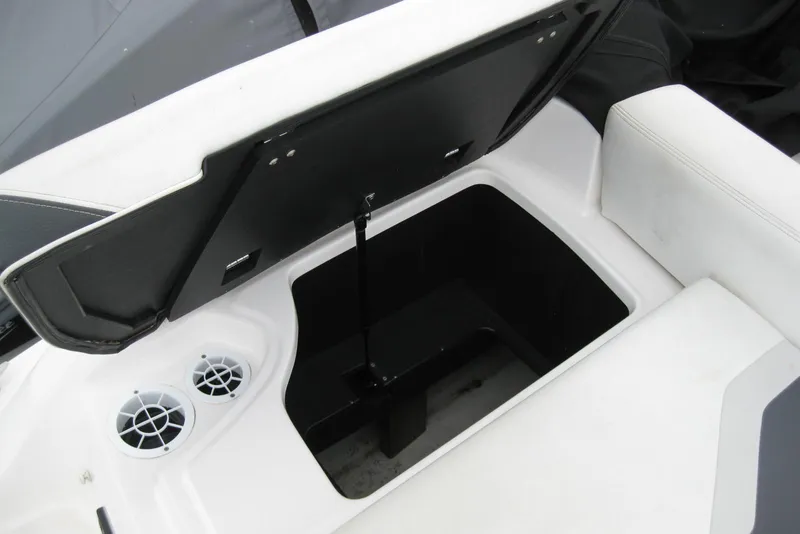 Slide: The Image of Open storage compartment in 2017 Regal 2000 ES Bowrider boat interior. - 9