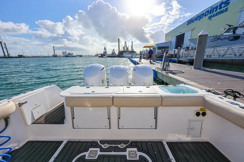 Slide: The Image of 2017 Everglades 355 Center Console docked at Bluepoints Marina under a sunny sky. - 23