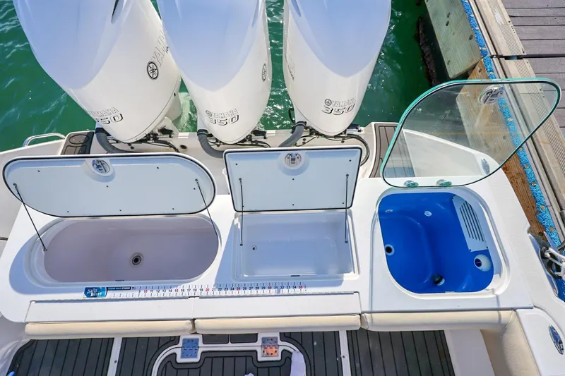 Slide: The Image of 2017 Everglades 355 Center Console boat with Yamaha 350 engines and open storage compartments. - 24