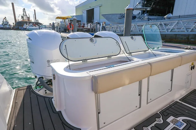 Slide: The Image of 2017 Everglades 355 Center Console boat with Yamaha engines docked at marina. - 26