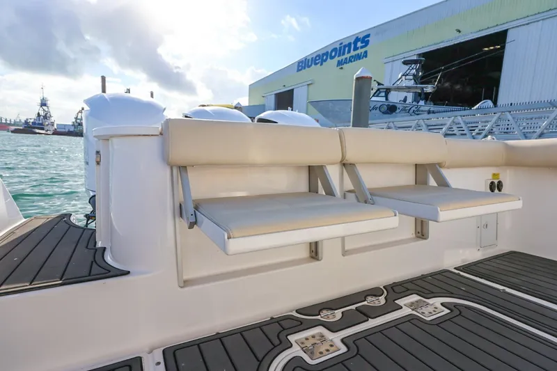 Slide: The Image of 2017 Everglades 355 Center Console boat with foldable seats at Bluepoints Marina. - 27