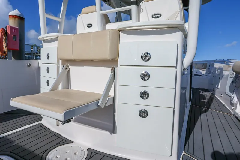 Slide: The Image of 2017 Everglades 355 Center Console boat with foldable seat and storage drawers. - 32