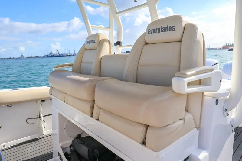 Slide: The Image of Luxury seating on 2017 Everglades 355 Center Console boat, ocean backdrop. - 39