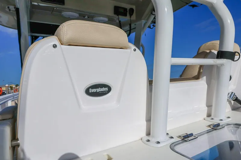 Slide: The Image of 2017 Everglades 355 Center Console boat interior with beige seating and Everglades logo. - 43