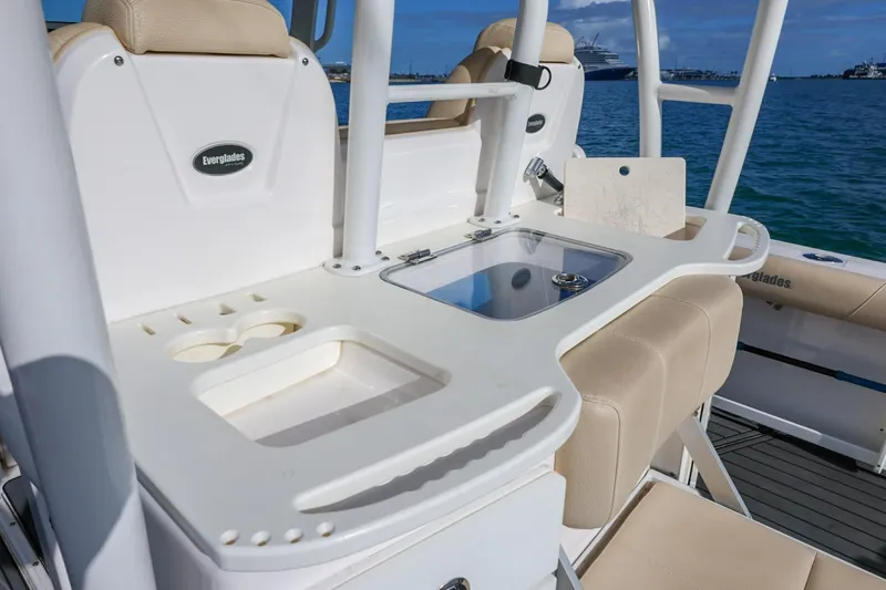 Slide: The Image of 2017 Everglades 355 Center Console boat interior with seating and utility area. - 44
