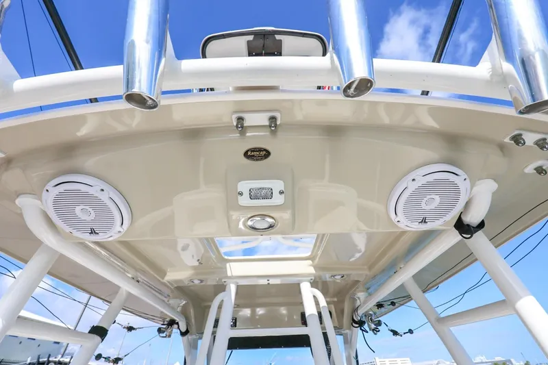 Slide: The Image of 2017 Everglades 355 Center Console boat roof with speakers and rod holders. - 45