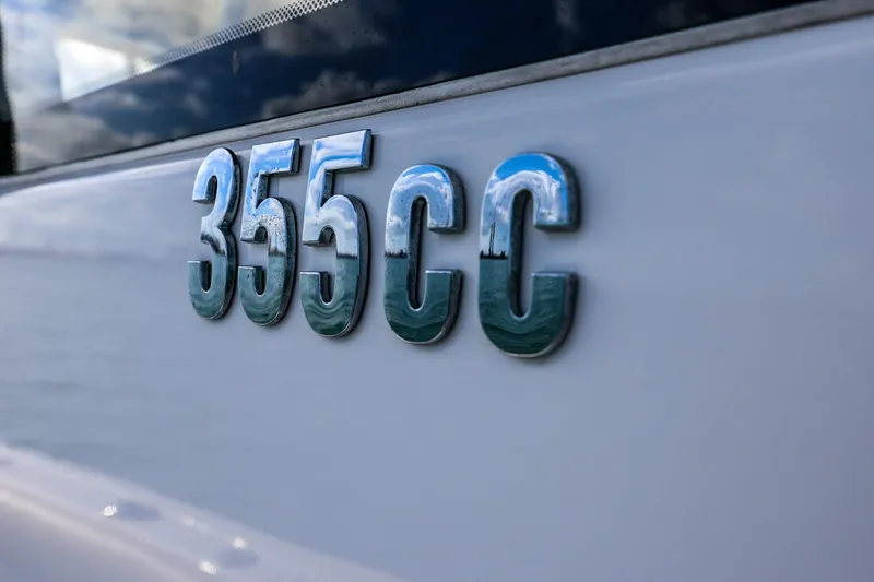 Slide: The Image of Close-up of 2017 Everglades 355 Center Console boat emblem on hull. - 47