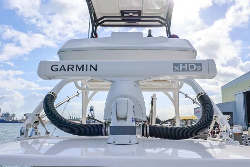 Slide: The Image of 2017 Everglades 355 Center Console with Garmin xHD2 radar at a marina. - 51