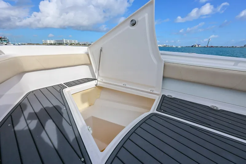 Slide: The Image of Open storage compartment on 2017 Everglades 355 Center Console boat deck. - 55