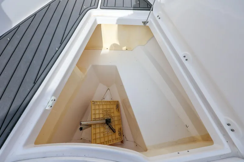 Slide: The Image of Storage compartment of 2017 Everglades 355 Center Console boat, featuring a clean interior. - 56
