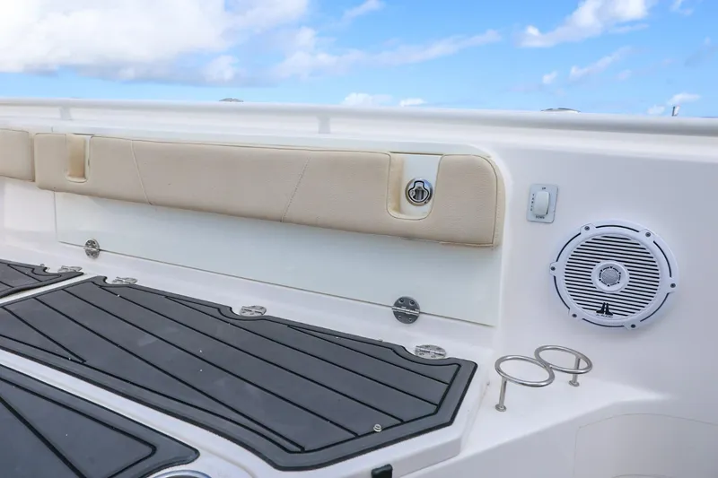 Slide: The Image of 2017 Everglades 355 Center Console boat interior with speaker and cup holders. - 58
