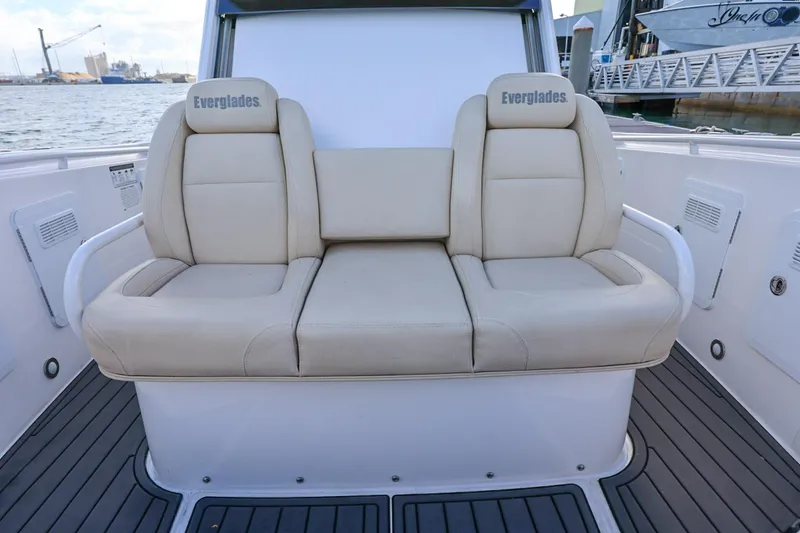 Slide: The Image of Luxury seating on 2017 Everglades 355 Center Console boat, dockside view. - 60