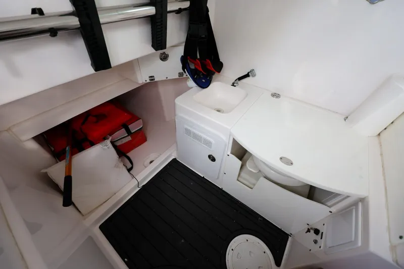Slide: The Image of Interior of 2017 Everglades 355 Center Console boat with sink and storage compartments. - 67