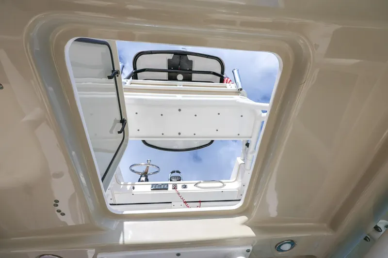Slide: The Image of View through the sunroof of a 2017 Everglades 355 Center Console boat. - 72