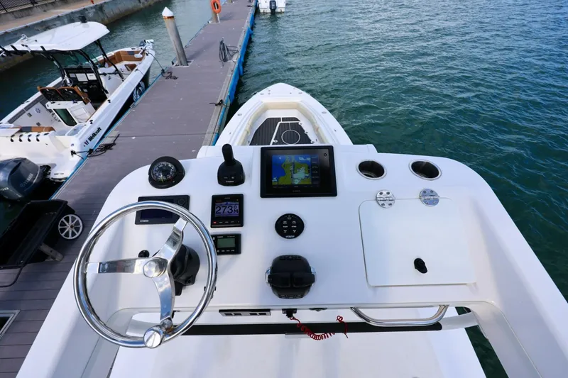 Slide: The Image of 2017 Everglades 355 Center Console boat dashboard with navigation equipment at dock. - 74