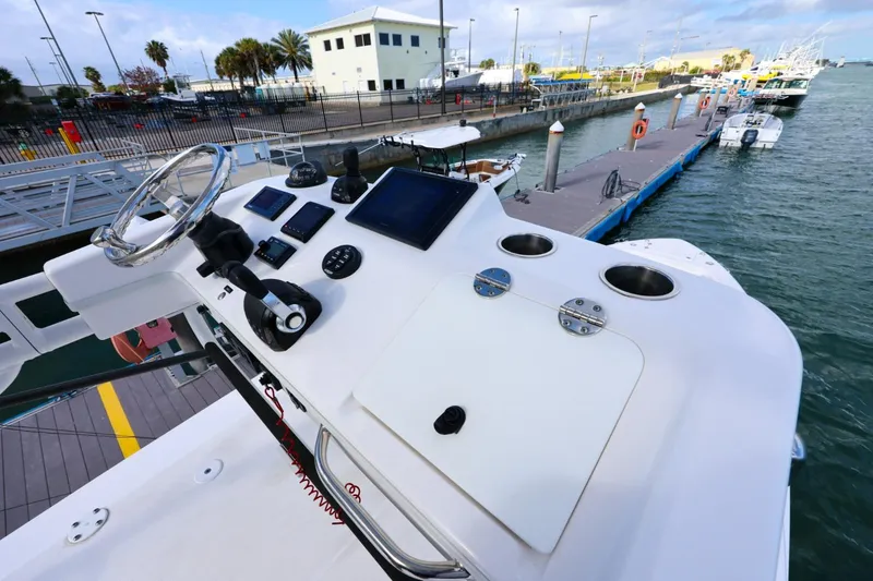 Slide: The Image of 2017 Everglades 355 Center Console boat dashboard at marina dock. - 76