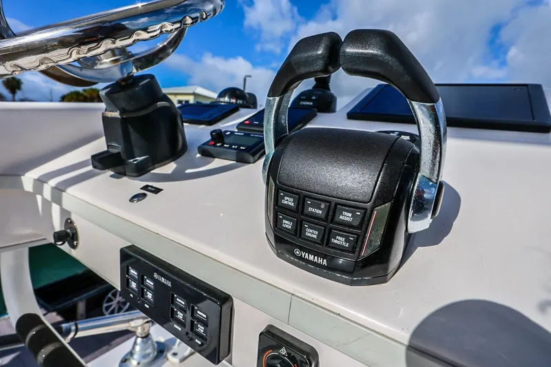 Slide: The Image of Control panel of a 2017 Everglades 355 Center Console boat with Yamaha throttle. - 77