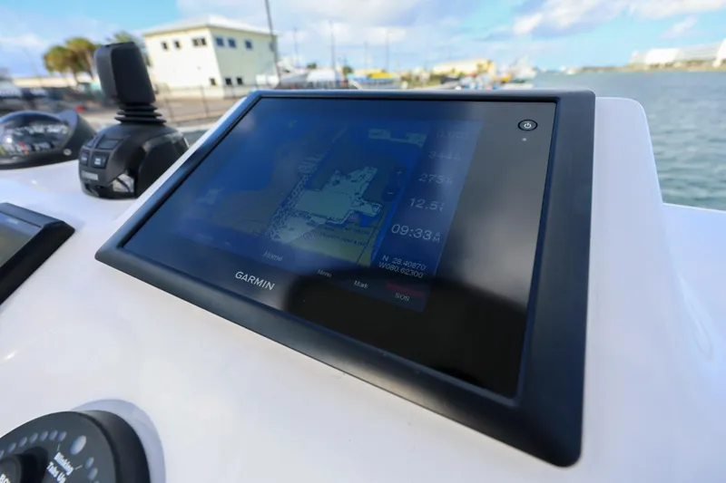 Slide: The Image of Garmin navigation display on 2017 Everglades 355 Center Console boat, dockside view. - 80