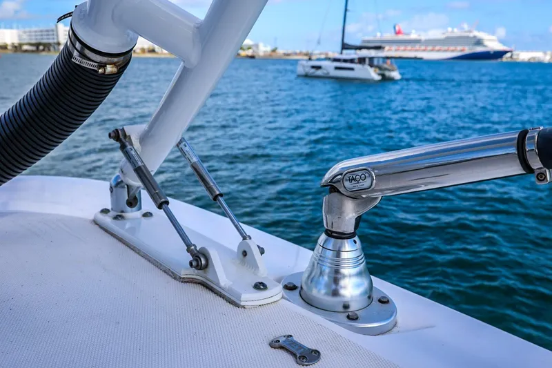 Slide: The Image of Close-up of Everglades 355 Center Console boat hardware, ocean and ships in background. - 81