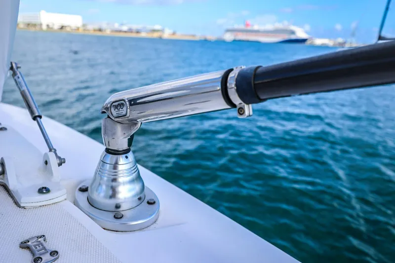 Slide: The Image of Close-up of a 2017 Everglades 355 Center Console boat's rod holder by the sea. - 82