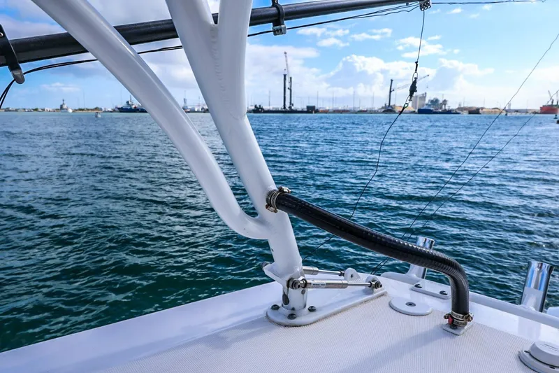Slide: The Image of 2017 Everglades 355 Center Console boat on water, with harbor view in background. - 83