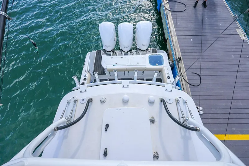 Slide: The Image of Overhead view of 2017 Everglades 355 Center Console boat docked by the water. - 84