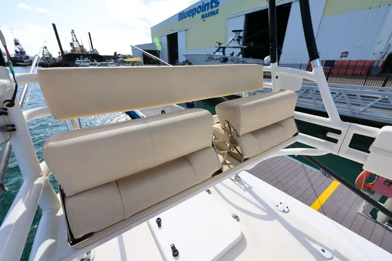 Slide: The Image of 2017 Everglades 355 Center Console boat seating at marina dock. - 85