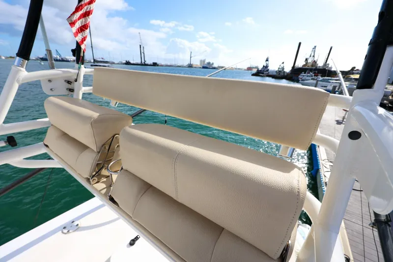 Slide: The Image of Beige seating on 2017 Everglades 355 Center Console boat, docked by the harbor. - 86