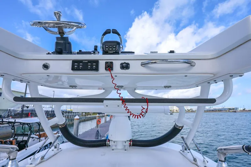 Slide: The Image of Control panel of 2017 Everglades 355 Center Console boat with ocean backdrop. - 89