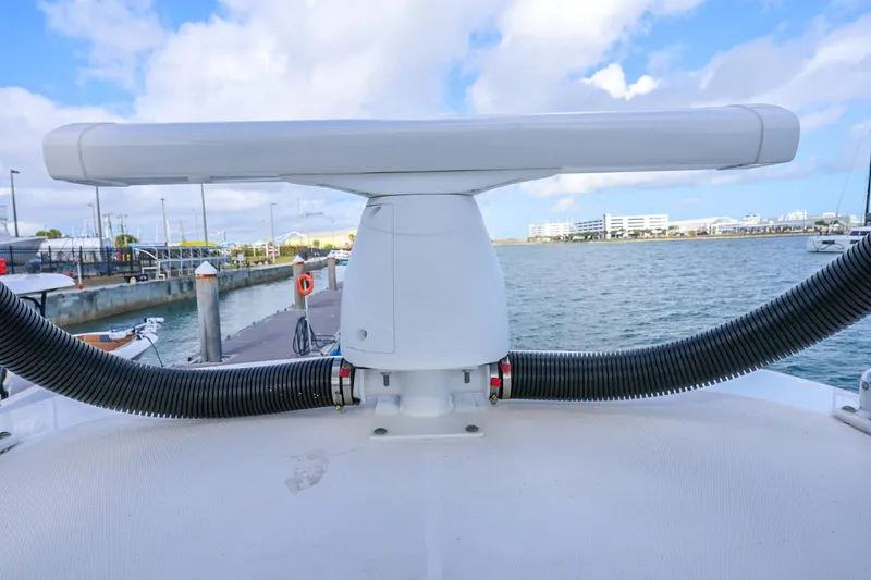 Slide: The Image of Radar system on a 2017 Everglades 355 Center Console boat docked by the water. - 91