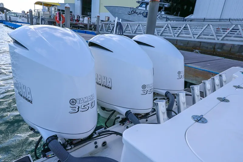 Slide: The Image of Triple Yamaha 350 outboard engines on a 2017 Everglades 355 Center Console boat. - 92