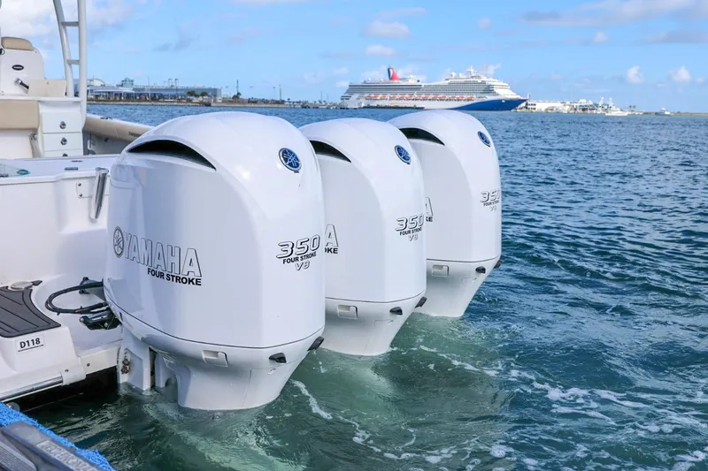Slide: The Image of Triple Yamaha 350 outboard engines on 2017 Everglades 355 Center Console boat. - 93