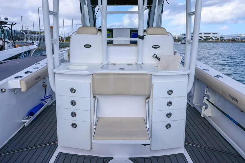 Slide: The Image of 2017 Everglades 355 Center Console boat interior with seating and storage compartments. - 99