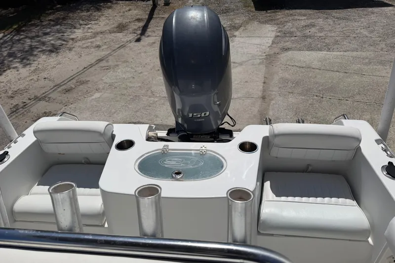 Slide: The Image of 2017 Sea Hunt Triton 210 boat with Yamaha 150 engine and seating area. - 14