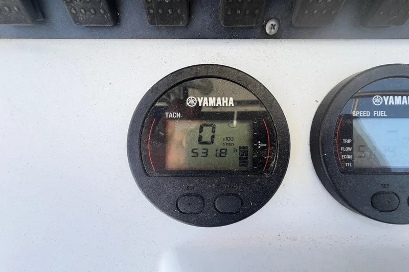 Slide: The Image of Yamaha tachometer and speed fuel gauges on 2017 Sea Hunt Triton 210 boat dashboard. - 32